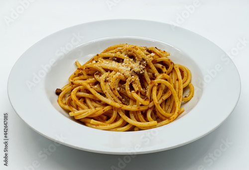 A dish of Italian Spaghetti with Bolognese Ragù and Parmigiano Reggiano Cheese.