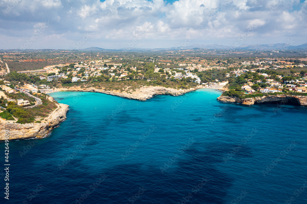 An aerial panoramic image of Cala Anguila in Estany d'en Mas on Mallorca island in Spain