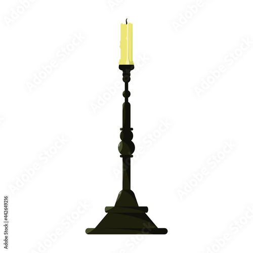An old candlestick with a burning candle. Vintage.