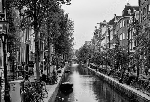 AMSTERDAM, NETHERLANDS. JUNE 06, 2021. Beautiful view of Amsterdam with typical dutch houses, bridges and chanel.