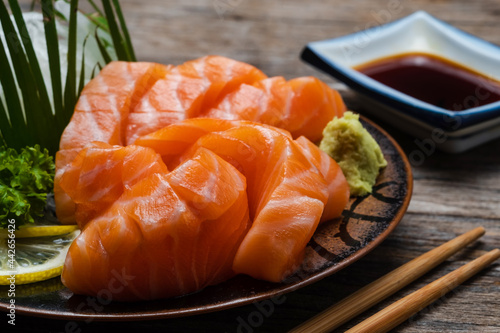 Sushi salmon & tuna sushi shrimp and wasabi on the white plate.