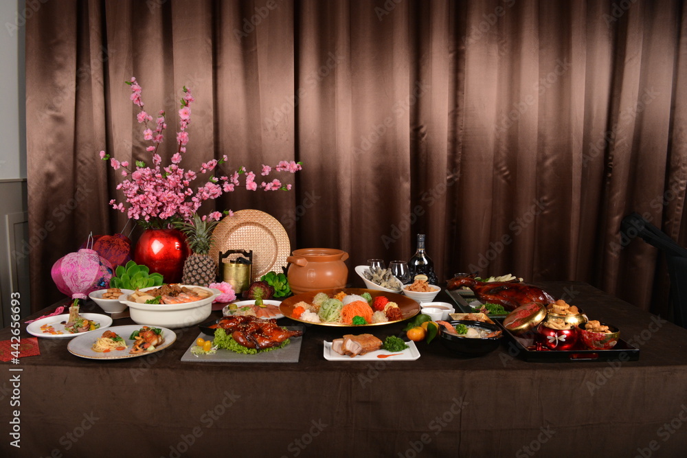 chinese new year festival asian food cuisine with meat, vegetable, noodle and yusheng lo hei with sakura flower decoration banquet halal dining menu