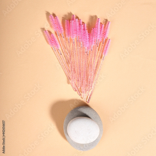 multi-colored brushes for eyelash extensions, many different brushes for lashmakers. photo