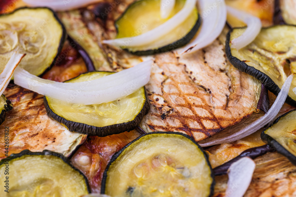 Close-up of pizza topped with grilled eggplant, zucchini and onion. Macro shot of delicious products. Close-up of pizza topped with grilled eggplant, zucchini and onion. Macro shot of delicious products.