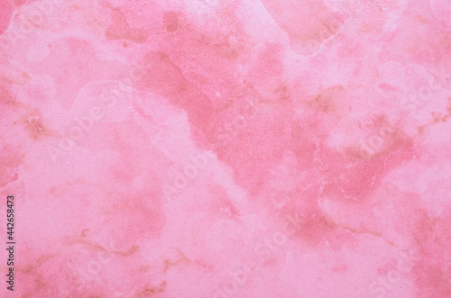 Pink wall background with marble pattern. Horizontal format