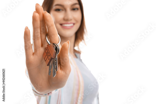 Happy young woman with key ...