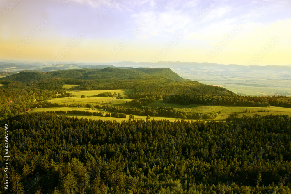 Fototapeta premium View from Great Szczeliniec, Szczeliniec Wielki highest peak of Stolowe Mountains to small, historic village of Pasterke and Czech part of Table Mountains with Koruna and Bozanovski Spicak peak Poland