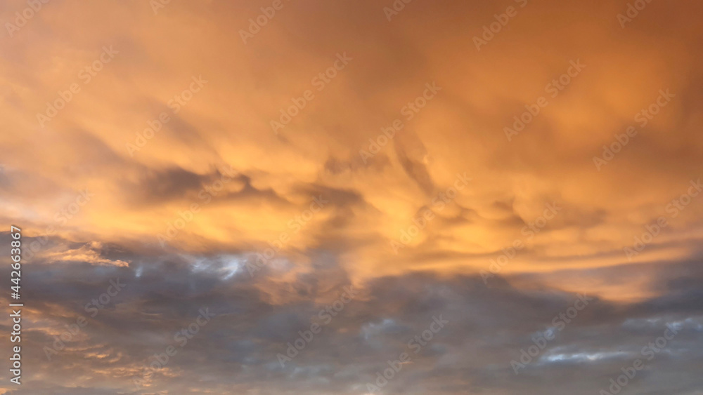 Golden Sunset, Sunset sky, sky background, picturesque sunset sky landscape with dramatic orange clouds. Sunset sky, sky background, picturesque sky