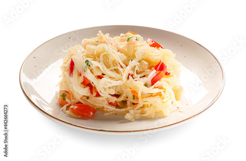 Plate with tasty sauerkraut on white background