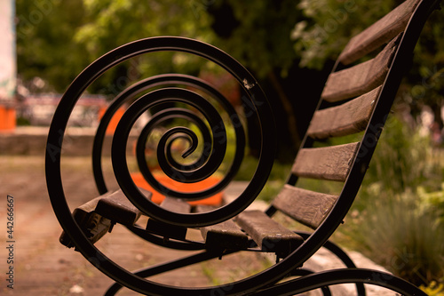 the spiral railings of the bench  photo