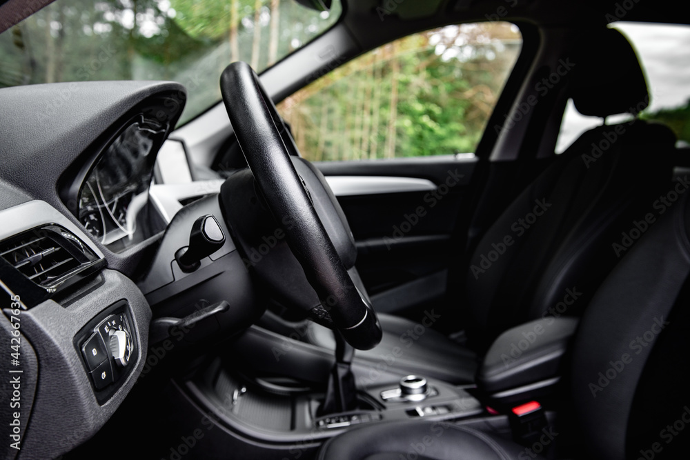 Car steering wheel side profile view. Lever for steering wheel adjustment. Car steering wheel side profile view. Lever for steering wheel adjustment.