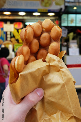 Canvas Print Hand holding butter Waffle in Hong Kong style