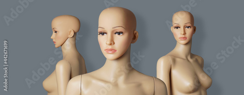 group of 3 naked and bald store window mannequins or display dummies with realistic faces