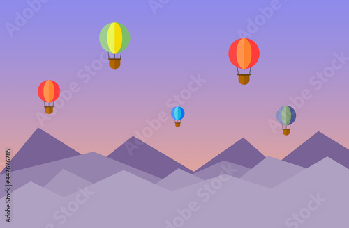 Vector illustration of hot air balloons over mountains.