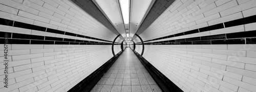 Tunnel Super Wide Angle of Tunnel Symmetrical Walkway with tiles on the ceiling and floor and walls