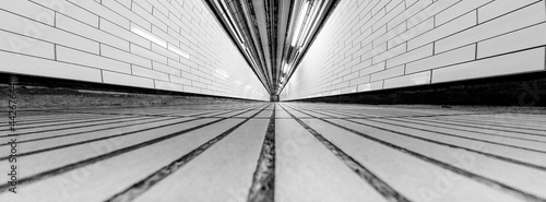 Tunnel Super Wide Angle of Tunnel Symmetrical Walkway with tiles on the ceiling and floor and walls