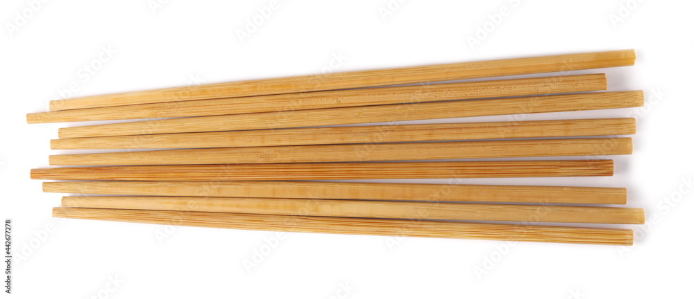 Asian wooden chopsticks set for eating isolated on white background, top view Asian wooden chopsticks set for eating isolated on white background, top view
