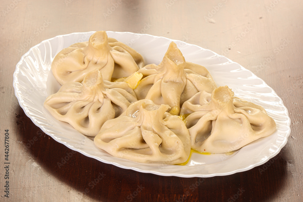 Georgian traditional cuisine – Khinkali with meat Georgian traditional cuisine – Khinkali with meat