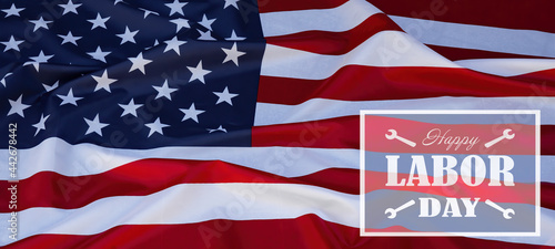 Fototapeta Naklejka Na Ścianę i Meble -  Happy Labor Day background banner  greting card template - Waving American flag and lettering with working symbols