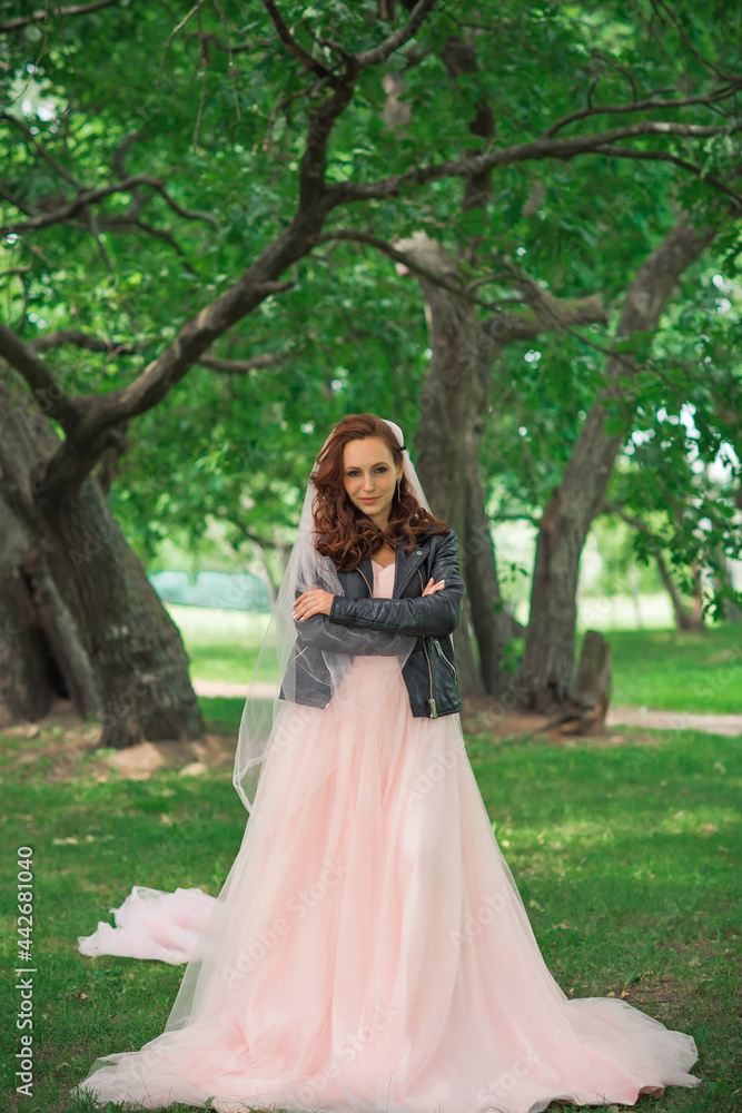 Tender elegant young bride in pink pastel wedding dress, fashionable fancy collection