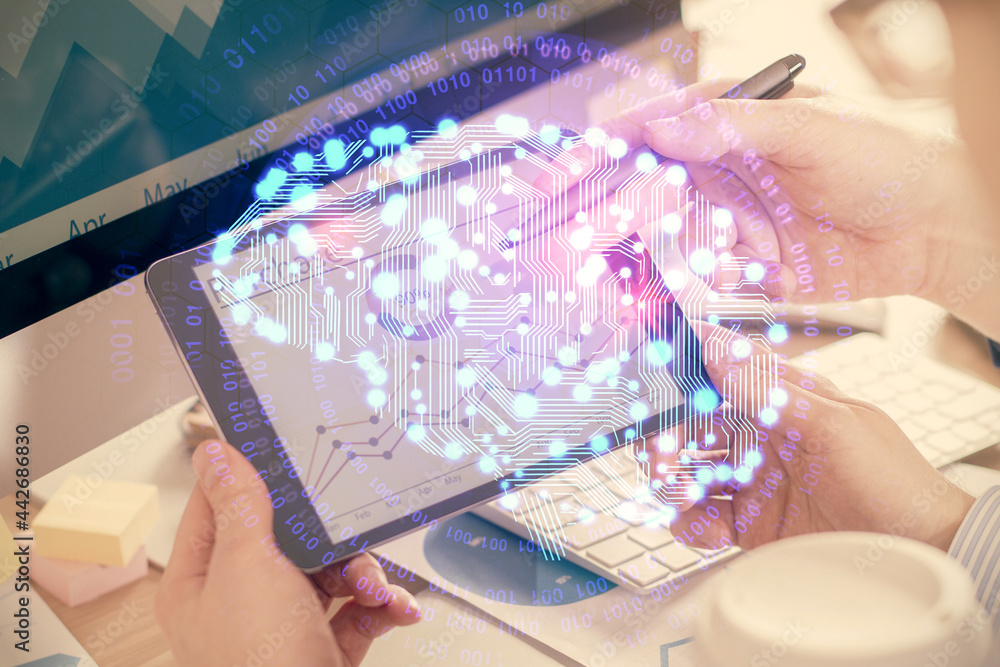 Double exposure of man's hand holding and using a digital device and brain hologram drawing. Data concept. Double exposure of man's hand holding and using a digital device and brain hologram drawing. Data concept.
