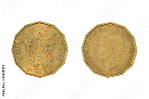 A British three pence coin of 1937. Obverse: King George VI. Reverse: Flowering thrift plant photo