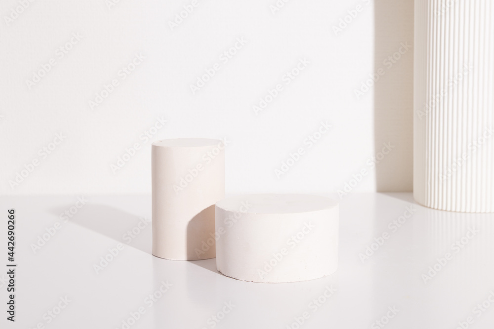 Empty cylindrical podium or pedestal with on a white background. Blank shelf product standing background Empty cylindrical podium or pedestal with on a white background. Blank shelf product standing background