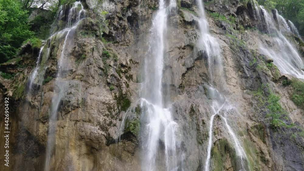 Waterfall in Plitvice Lakes national Park at summer, Croatia. Waterfalls formed by mountain lakes due to melting glaciers Waterfall in Plitvice Lakes national Park at summer, Croatia. Waterfalls formed by mountain lakes due to melting glaciers