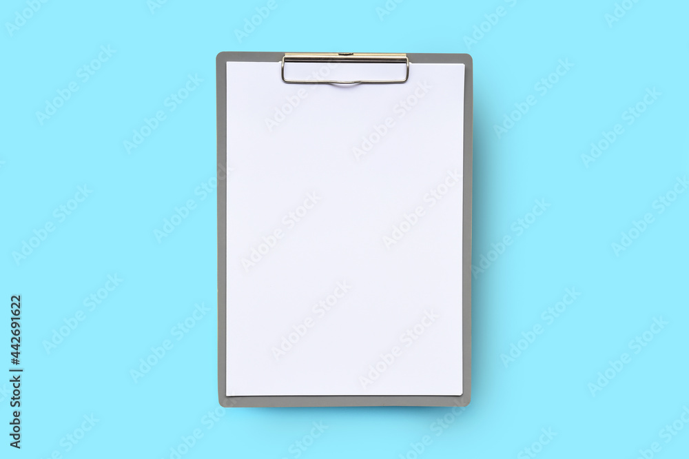 close up of empty paper on blue background close up of empty paper on blue background