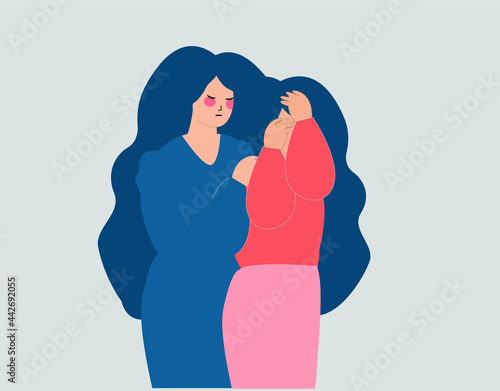 Young woman covering her face with hands and supported by her best friend due to depression. Female consols her crying girlfriend and cares about her. Mental health mother and daughter support concept photo