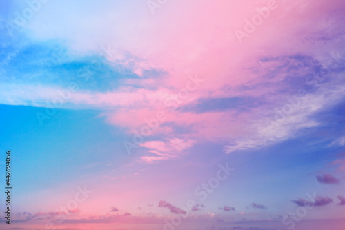 A beautiful neon pink and blue sky with clouds. A cloudscape from fancy dreams.
