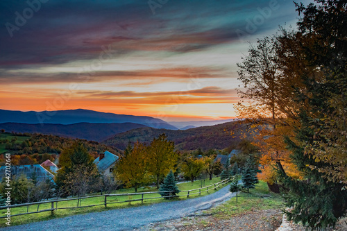 Tableau sur toile Beautiful autumn mountains landscape, village at the sunset