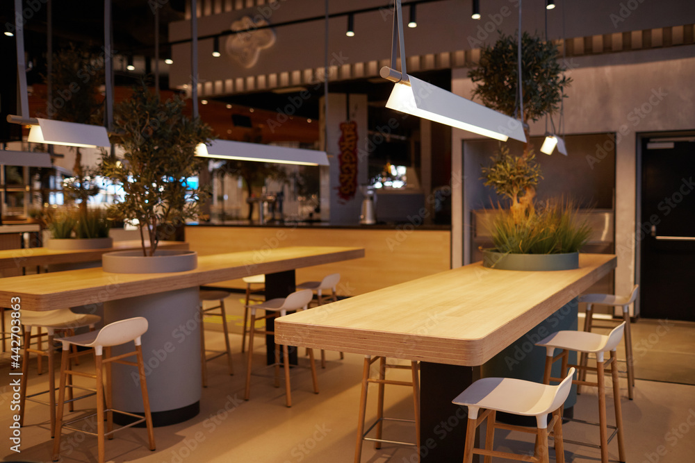 Background image of empty food court interior at modern shopping mall, copy space