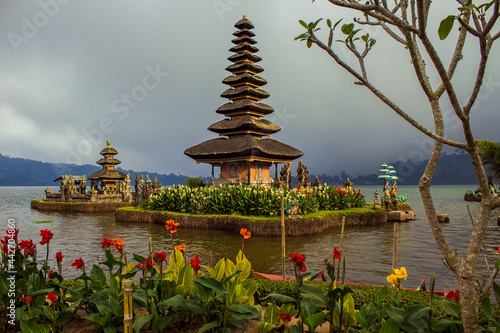 Pura Ulun Danu water temple on Lake Beratan near Bedugul mountains. Ulun Danu is a major Shaivite temple on Bali, Indonesia. Colorful Balinese landscape, travel and ancient architecture background