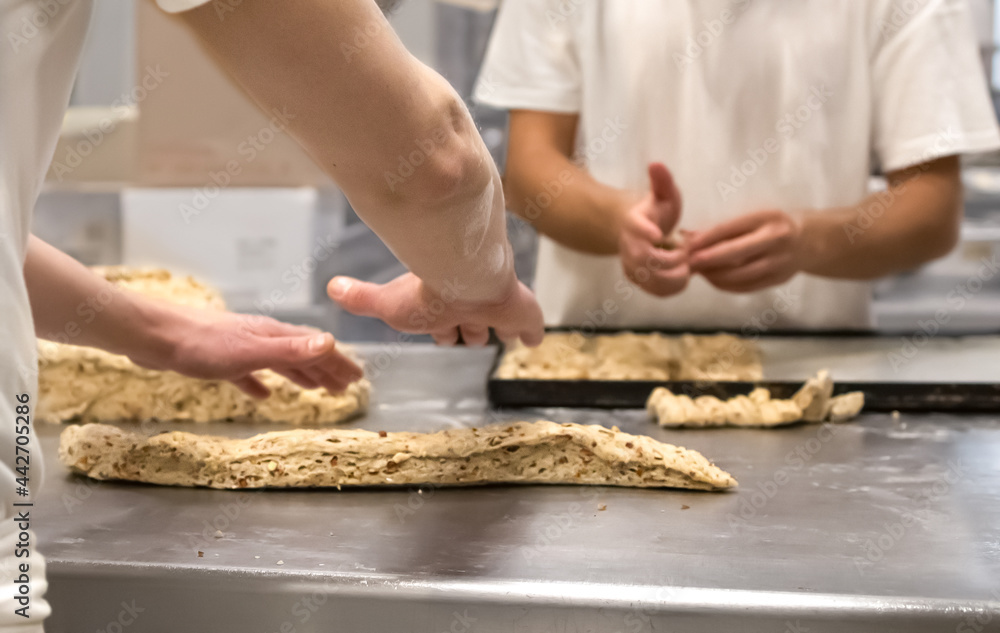 Pastry chef's hands making sweet and savory cookies. Manual processing of flour varieties