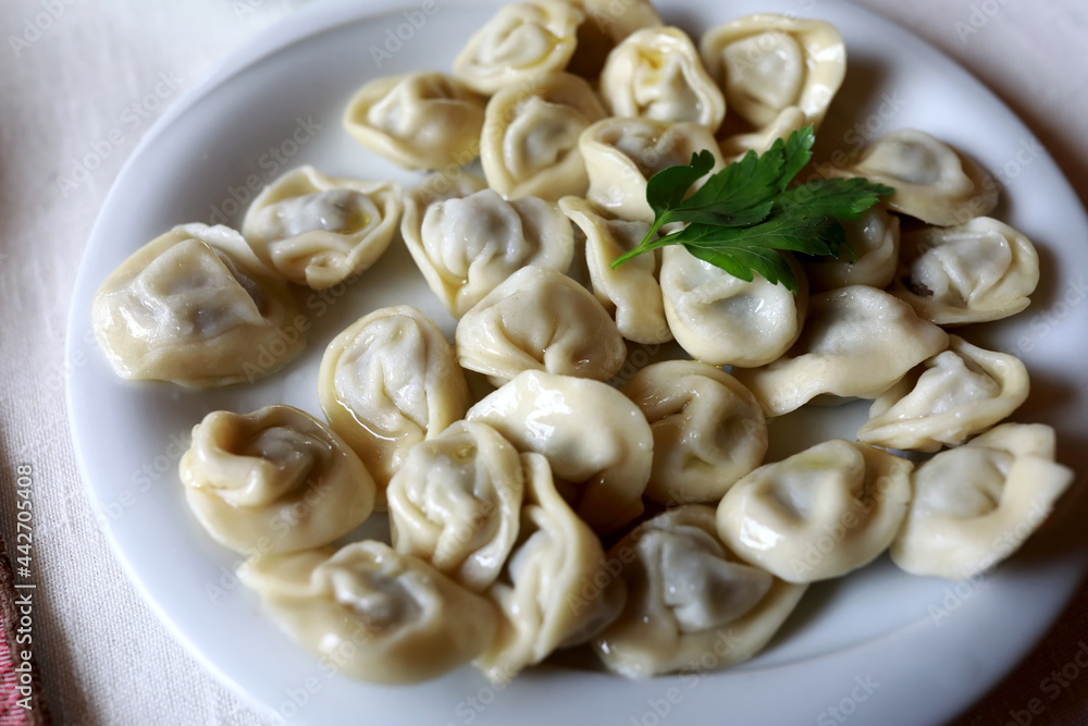 Dumplings on white plate with butter Dumplings on white plate with butter