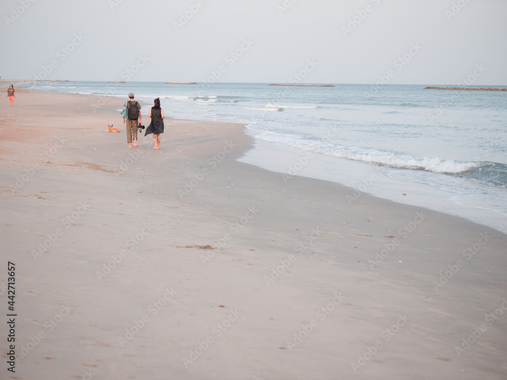 couple walking on the beach,relax on summer long holliday couple walking on the beach,relax on summer long holliday