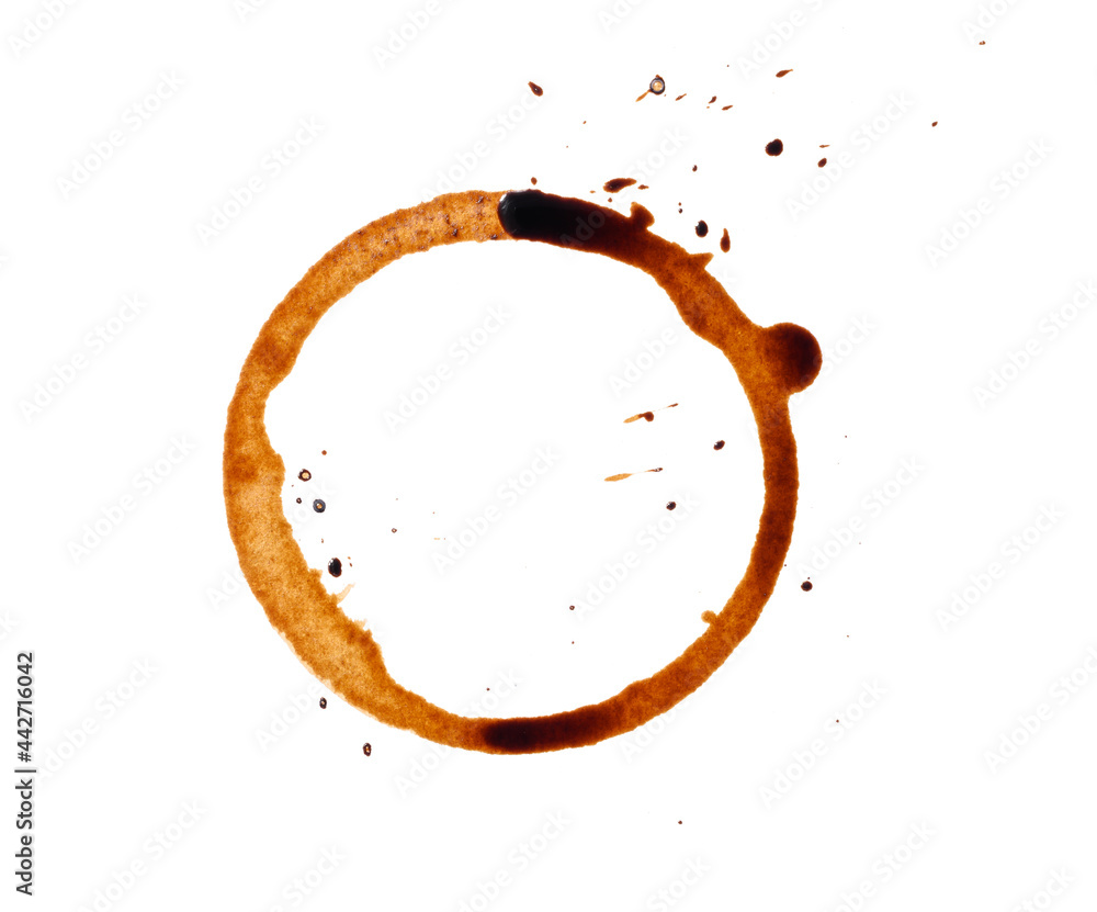 spilled black coffee on a white background. Round blotprint from the bottom of the cup with fine splashes spilled black coffee on a white background. Round blotprint from the bottom of the cup with fine splashes