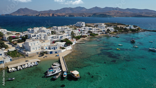 Aerial drone photo of picturesque fishing village of Polonia or Pollonia with traditional fishing boats anchored next to island of Kimolos, Milos island, Cyclades, Greece photo