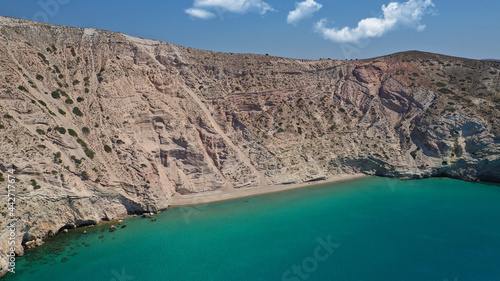Aerial drone photo of beautiful scenic but inaccessible by car steep cliff and beach of Gerakas with crystal clear emerald sea next to famous beach of Tsigrado, Milos island, Cyclades, Greece