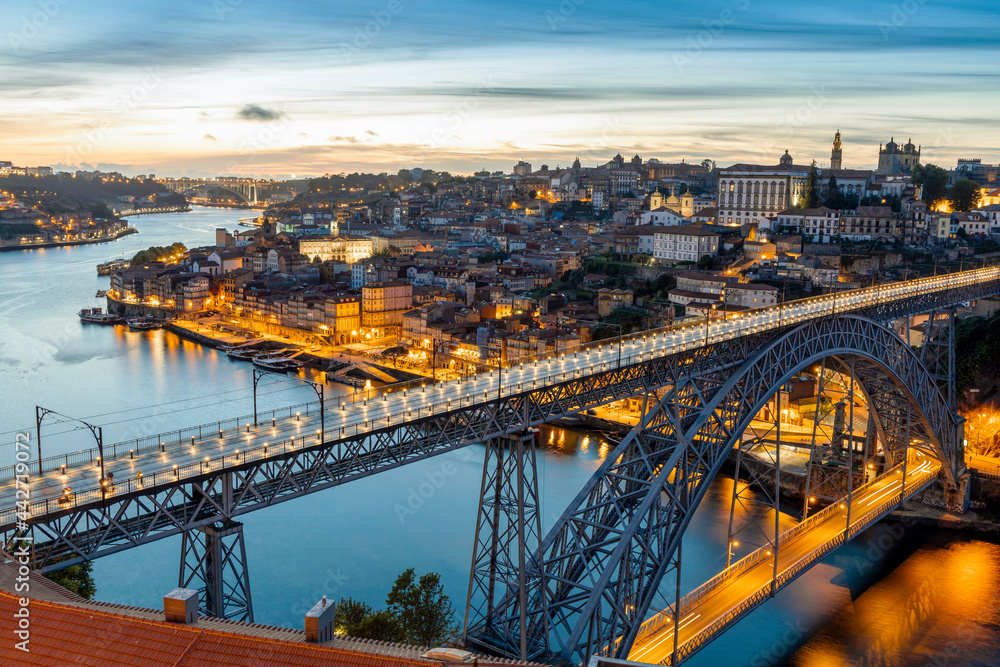 Skyline of the historic city of Porto with famous bridge at night, Portugal