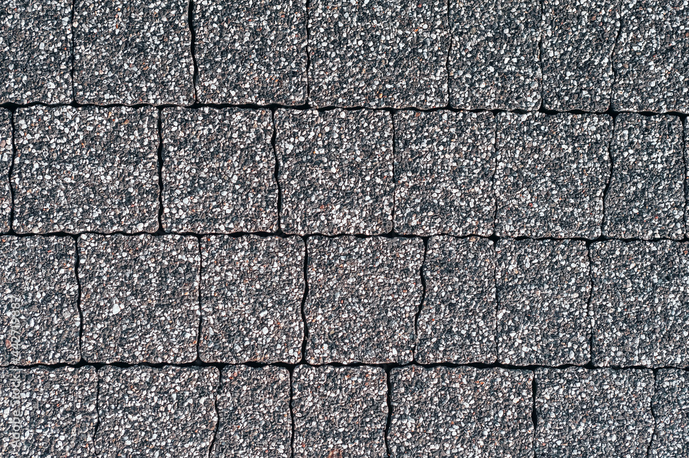 Gray paving slabs urban street road floor stone tile texture background, top view