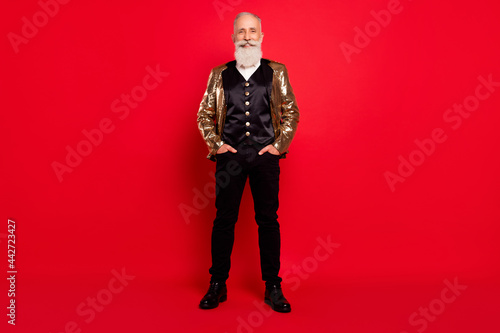 Full size photo of aged man happy positive smile confident wear costume showman isolated over red color background