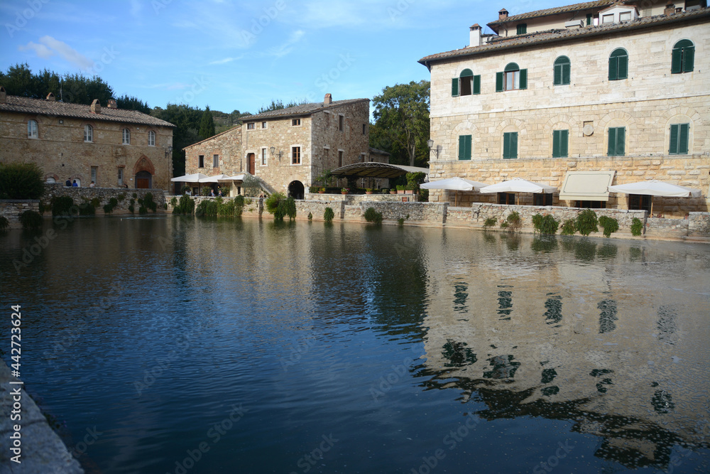 the village is located in Val d'Orcia and its square is a thermal swimming pool surrounded by stone houses and a wash house.