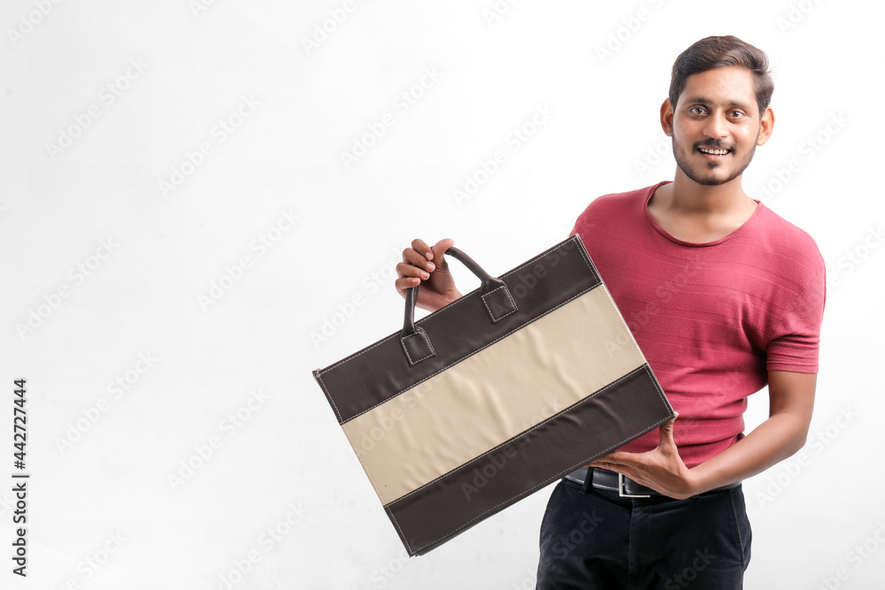 Young indian man showing excitement with shopping bags