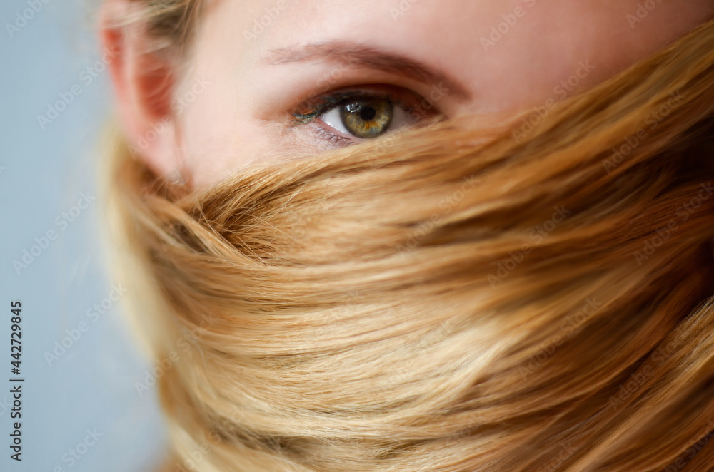 Portrait of a girl, her hair covers her face