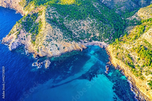 view of a island, green coastline and sea, mallorca, spain