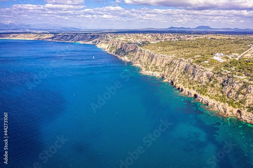 Fototapeta Naklejka Na Ścianę i Meble -  view of a island, green coastline and sea, mallorca, spain