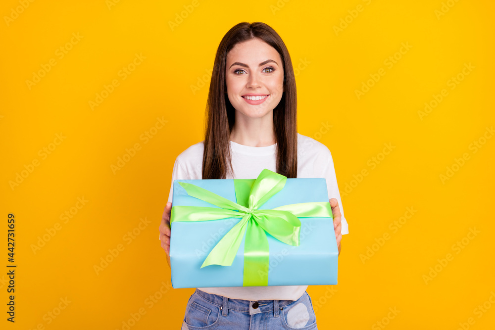 Photo of happy cheerful beautiful stunning lovely girl give you birthday gift present isolated on yellow color background Photo of happy cheerful beautiful stunning lovely girl give you birthday gift present isolated on yellow color background