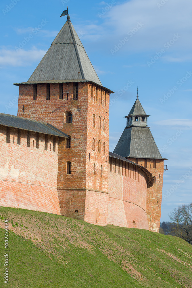 Two towers of the ancient Kremlin of Veliky Novgorod close-up on a sunny April day. Russia